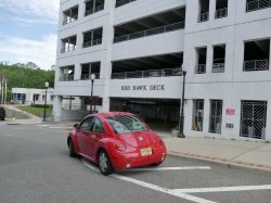 Red buggy driving into Red Hawk Deck