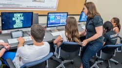Gifted and Talented students getting help on their computer projects
