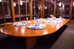 The President's Dining Room set up at night with some intricate candles and decorations.