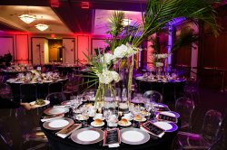 Custom table setup with centerpieces and dining setup in the Main Ballroom.