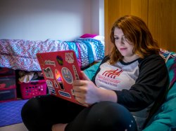 student in dorm room