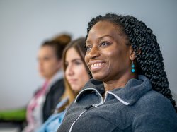 Students in class smiling