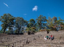 A few students sitting on the amphitheatre