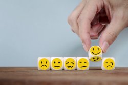 Wooden cubes with different faces.