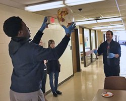 Students doing experiment in hallway