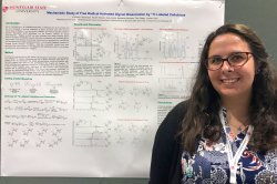 Kimberly Fabijanczuk presenting her poster at a conference