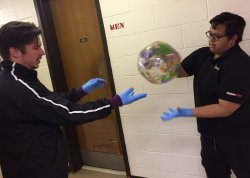 students passing globe