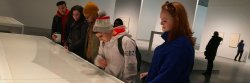 students looking at exhibit at the Shed Muesum