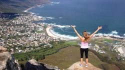 study abroad student on an overlook above a coastal town