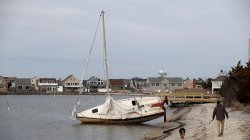 An abandoned boat is washed ashore on Bay View Avenue near 24th Avenue in Seaside Park