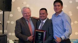 Dr. Claudio Fernandez with Mayor Richard Turner receiving his induction plaque