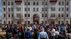 gathering outside of CELS for the solar eclipse on April 8