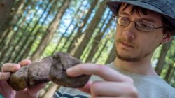 student comparing rocks
