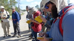 students taking notes on hike