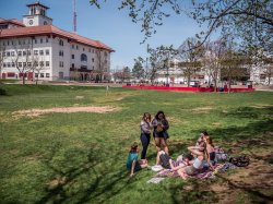 Students sitting in the Student Center Quad.