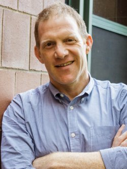 Head shot of Prof. Jonathan Greenberg.