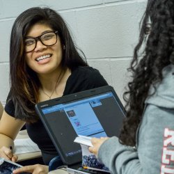 Student smiling in a poetry class.