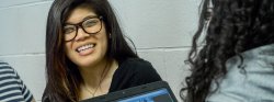 Student smiling in a poetry class.