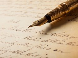 Image of a fountain pen with a manuscript.