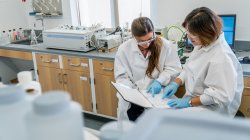 student and mentor going over lab data