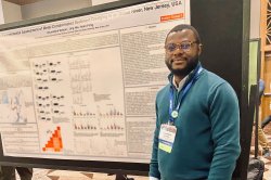 Oluwafemi Soetan with poster at a conference