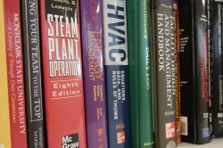 Facilities books on a bookshelf