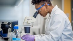 Woman using lab equipment