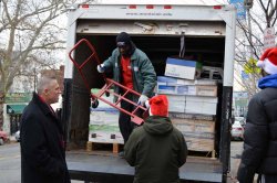 MSU Facilities staff unloading paper from the truck.