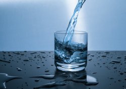 Glass being filled with water