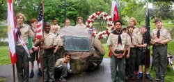 Boy scount troop in front of monument