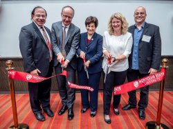 Cutting the ribbon are, from the left, Keynote Speaker Anthony Scriffignano, University board member Francis Cuss, Susan A. Cole, Lora Billings and Constantine Coutras.