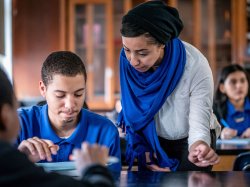 Woman and teenage student reviewing notes