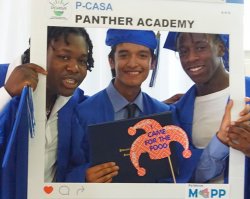 Students from Paterson wearing caps and gowns