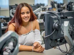 Woman sitting in a computer lab at Montclair State