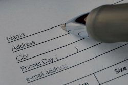 A pen filling out a form.