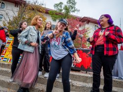 students dancing on campus