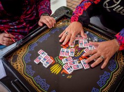 overhead view of domino game in progress