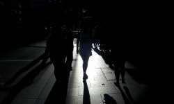 people and shadows on sidewalk