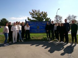 group of people standing outside next to sign for NJ Dept. of Corrections