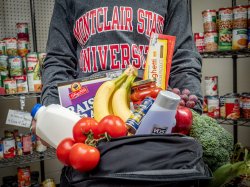 Student with food from the pantry