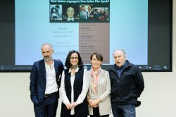 Image of presenters at lecture.