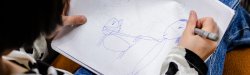 Photo of child drawing a picture