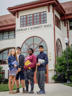 students outside of campus building