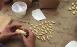 hands making pasta