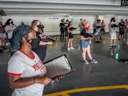 choir students in parking garage