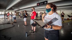 choir students in parking garage