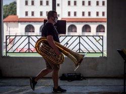 Student carrying tuba