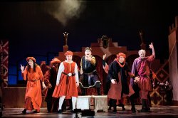 Scchicci opera cast on stage in dramatic pose
