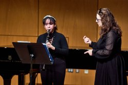 Pathways program clarinet student on stage receiving a lesson from clarinet professor