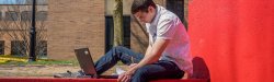 Photo of student on red steps